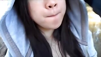 My cute asian girlfriend sucking me off in a public park and swallowing